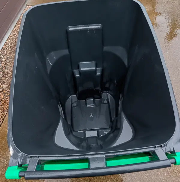 Clean and sanitized household trash can after high-pressure washing service